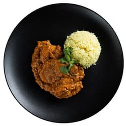 Chicken tikka masala with saffron rice by Mahavira Kanswala