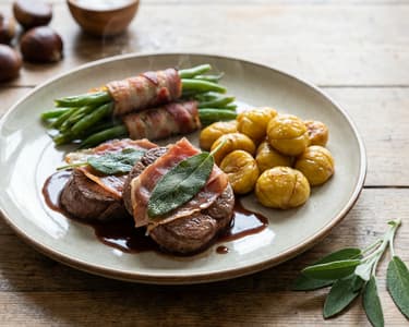 Saltimbocca of Venison Loin with Oven-Roasted Chestnuts and Bacon-Wrapped Green Beans
