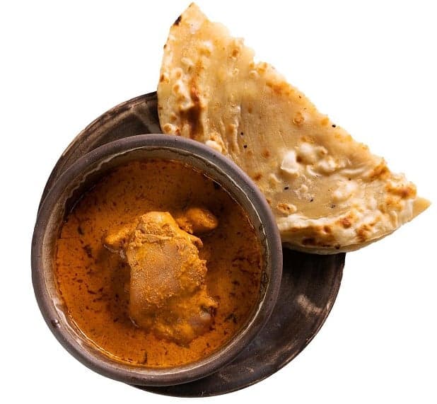 Butter chicken with naan bread by Mahavir Kanswal